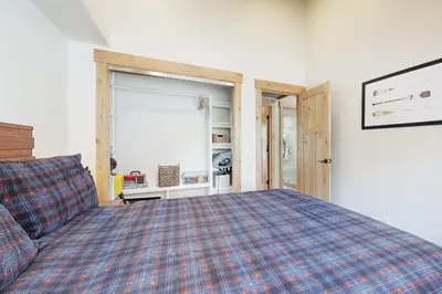 a bedroom with a large bed and a window at Westshore Oasis in Tahoma