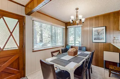 a dining room with a table and chairs at Sky Meadows Charmer in South Lake Tahoe