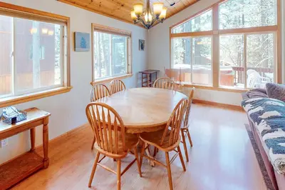 a dining room with a wooden table and chairs at Falcon Point Manor in Truckee