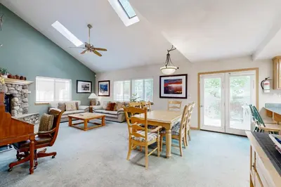 a kitchen and living room with a table and chairs at Oregon Oasis in South Lake Tahoe