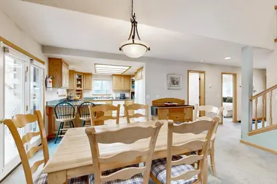 a dining room and kitchen with a table and chairs at Oregon Oasis in South Lake Tahoe
