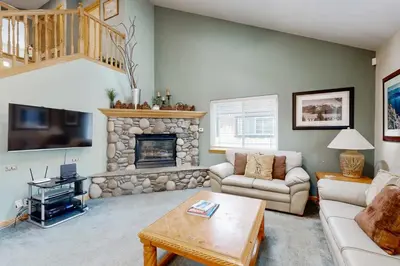 a living room with a couch and a fireplace at Oregon Oasis in South Lake Tahoe