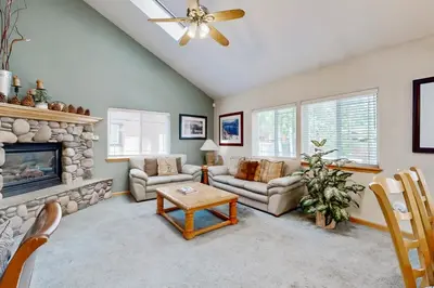 a living room with a couch and a fireplace at Oregon Oasis in South Lake Tahoe
