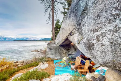 a group of chairs sitting next to a large rock at Cascade Charms in South Lake Tahoe