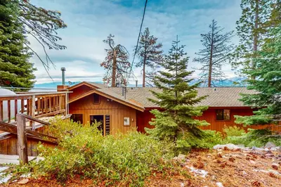 a wooden house with a porch and a deck at Cascade Charms in South Lake Tahoe