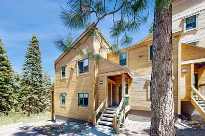 a wooden house with a tree at Gold Bend Escape in Truckee