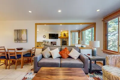 a living room with a couch and a table at Coyote Fork 4051 in Truckee