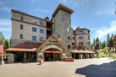 a large building with a tower on a street at Coyote Fork 4051 in Truckee