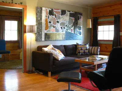 a living room with a couch and a table at Fivespot Cabin in Pinehurst