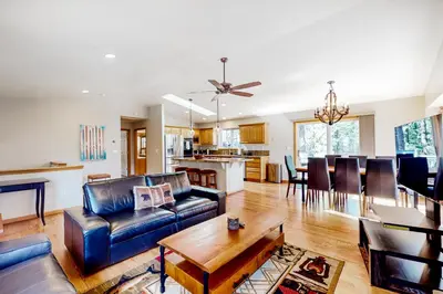 a living room with a couch and a table at Sunlit Forest Haven in South Lake Tahoe