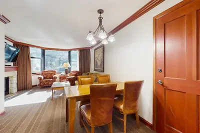 a dining room with a table and chairs at Resort at Squaw Creek's 319 in Olympic Valley