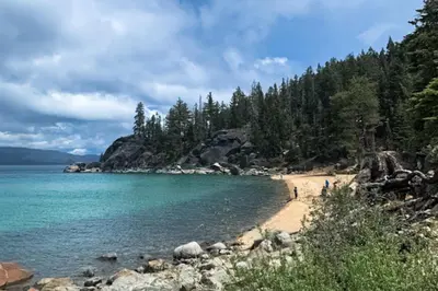 a beach on the shore of a body of water at West Shore Retreat in Tahoma