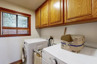 a kitchen with a washing machine with a box on top at Amazing Dollar Point Retreat in Tahoe City