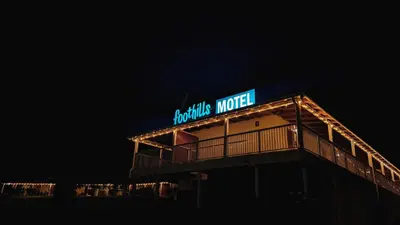 a building with a sign that reads horizons motel at Foothills Motel in Auburn