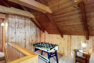 a room with a table with wine bottles in it at Dollhouse in Arnold