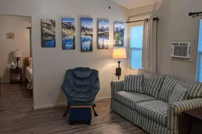 a living room with a couch and a chair at Mimi's Cabin in Squaw Valley