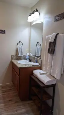 a bathroom with a sink and a mirror at Mimi's Cabin in Squaw Valley