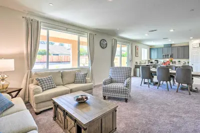 a living room with a couch and a table at Sacramento Retreat with Yard about 13 Mi to Dtwn! in Elk Grove