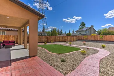 a yard with a patio and a lawn at Sacramento Retreat with Yard about 13 Mi to Dtwn! in Elk Grove