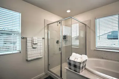 a bathroom with a shower and a bath tub at Sacramento Retreat with Yard about 13 Mi to Dtwn! in Elk Grove