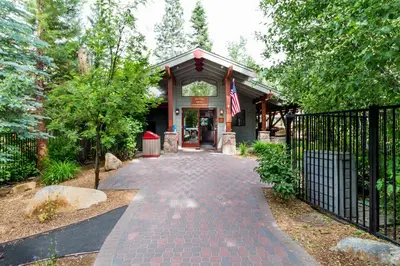 a house with a gate and a brick walkway at Mill Camp Gem in Ponderosa Fairway Estates