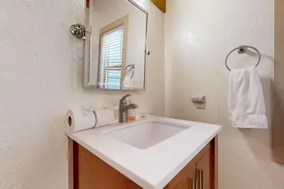 a bathroom with a white sink and a mirror at Gold Bend Adventure in Truckee
