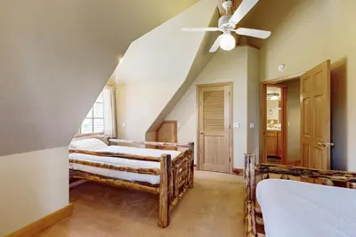 a bedroom with two beds and a ceiling fan at Marshall Haven in South Lake Tahoe