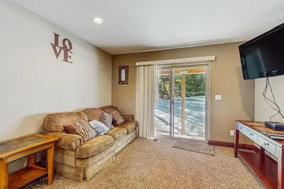 a living room with a couch and a tv at Miztec Charms in South Lake Tahoe