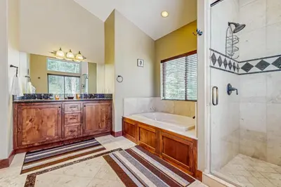 a large bathroom with a tub and a shower at Miztec Charms in South Lake Tahoe