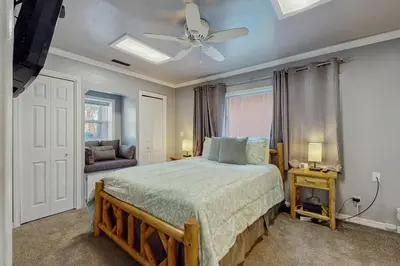 a bedroom with a bed and a ceiling fan at Apache Adventures in South Lake Tahoe