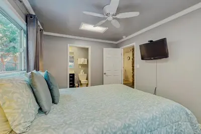 a bedroom with a bed and a ceiling fan at Apache Adventures in South Lake Tahoe