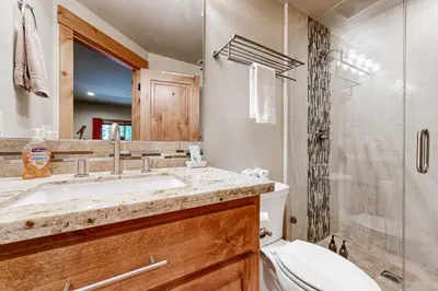 a bathroom with a sink and a toilet and a shower at Oslo Oasis in Truckee