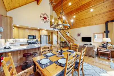 a kitchen and dining room with a table and chairs at Fawn Haven in Truckee