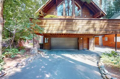 a house with a garage with a building at Fawn Haven in Truckee