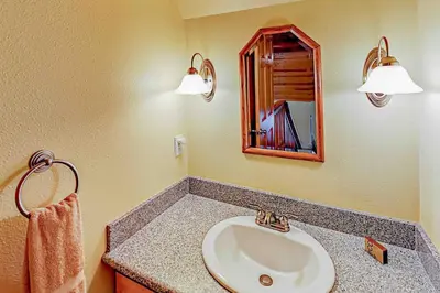 a bathroom with a sink and a mirror at Fawn Haven in Truckee