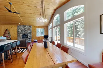 a dining room with a wooden table and chairs at Tyrol Getaway in Truckee