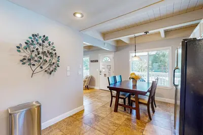 a kitchen and dining room with a table and chairs at Cougar Haven in South Lake Tahoe