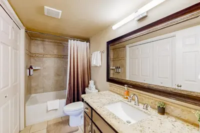 a bathroom with a sink and a toilet and a shower at Cougar Haven in South Lake Tahoe
