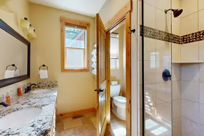 a bathroom with a shower and a sink and a toilet at Marshall Escape in South Lake Tahoe