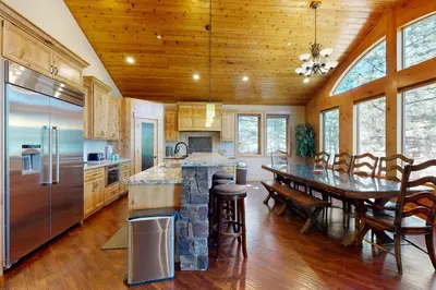 a kitchen and dining room with a table and chairs at Marshall Escape in South Lake Tahoe