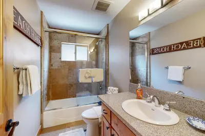 a bathroom with a sink and a shower and a toilet at Pine Haven in Kings Beach