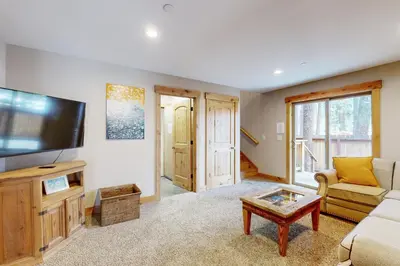 a living room with a couch and a tv at Pine Haven in Kings Beach