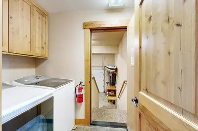 a small laundry room with a washer and dryer at Pine Haven in Kings Beach