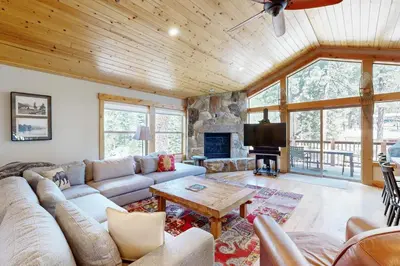 a living room with a couch and a table at Pine Haven in Kings Beach