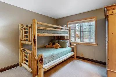 a bedroom with bunk beds and a window at Muhlebach Haven in Truckee