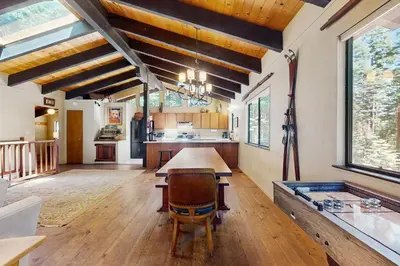 a large kitchen with a wooden table in a room at Simplon Pass Escape in Homewood
