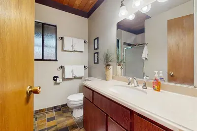 a bathroom with a sink and a toilet at Simplon Pass Escape in Homewood
