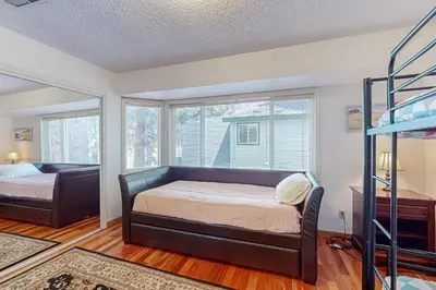a bedroom with a bed and a bunk bed at Lone Indian Charms in South Lake Tahoe