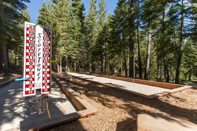 a sign that is in front of a park with trees at Ski-In, Ski-Out Designer Condo in Truckee