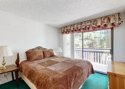 a bedroom with a bed and a large window at The Summit E3 in South Lake Tahoe